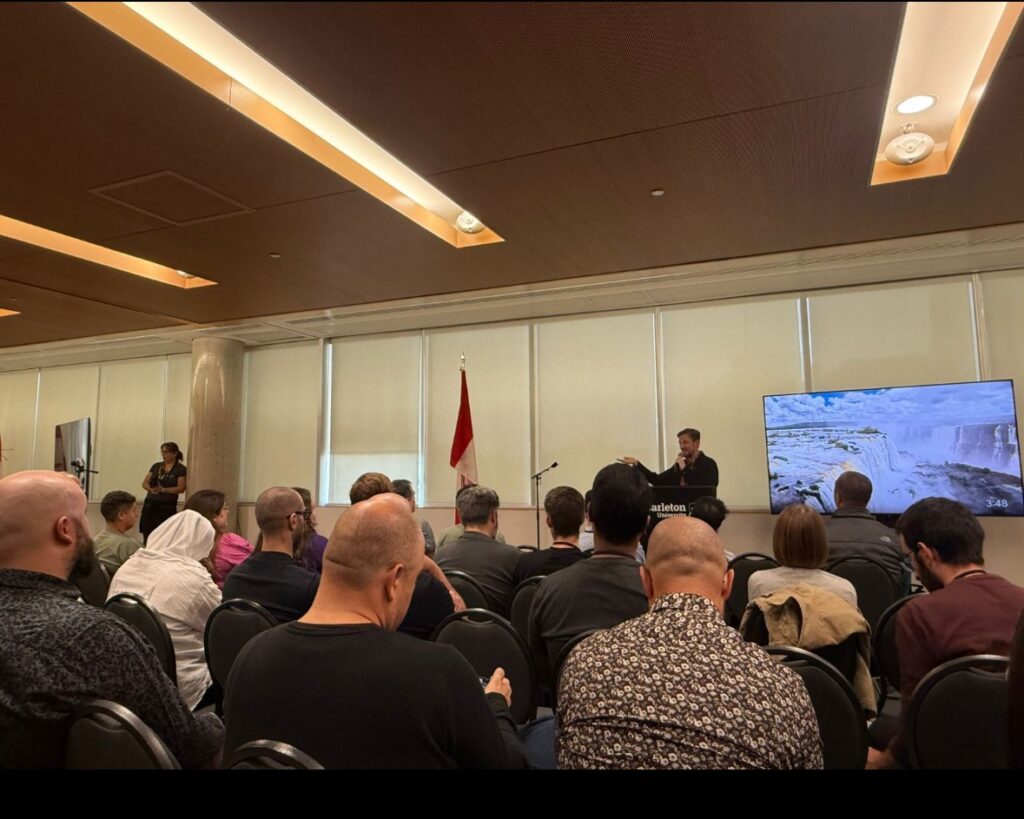 Bhumi from IT Path Solutions meeting fellow WordCamp Canada 2025 volunteers and organizers in person after a year of remote teamwork